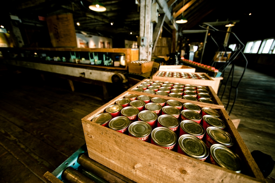Display of boxes full of cans inside the Gulf of Georgia Cannery National Historic Site in Steveston